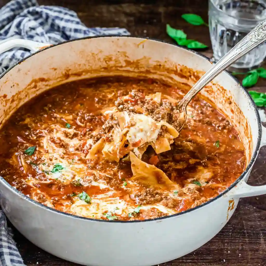 othmanrad White enameled Dutch oven on a wooden table filled 52e9c2bd 8509 406d bfce b6b30d4ceb39 2